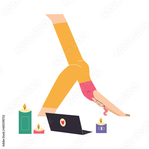 Yong woman watching online yoga classes on laptop, practicing yoga at home.