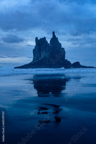 Particular rock formation in the water of the ocean reflecting on the shore, Benijo beach, Tenerife North