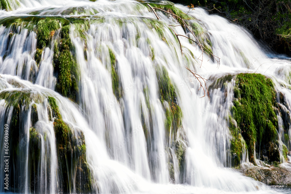 Close up view to water stream in the fast waterfall. Blurred motion water flow Close up view to water stream in the fast waterfall. Blurred motion water flow