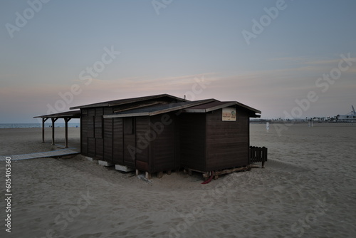 beach huts at sunset