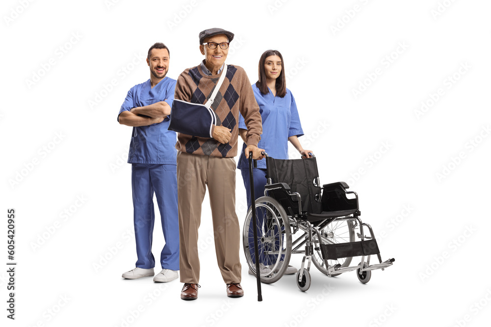 Male and female nurse with a wheelchair standing behind an elderly injured male patient Male and female nurse with a wheelchair standing behind an elderly injured male patient