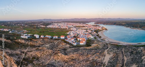 Aerial view in panorama format of the city of Vila Nova de Milfontes in western Portugal at sunrise