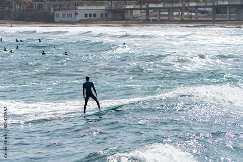 surfing on the beach of la cicer in Las Plamas de Gran Canaria photo