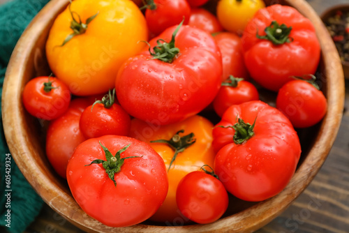 Bowl with different fresh tomatoes, closeup