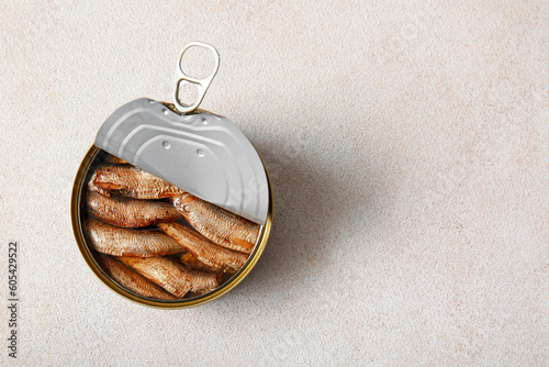 Canned smoked sprats on white background photo