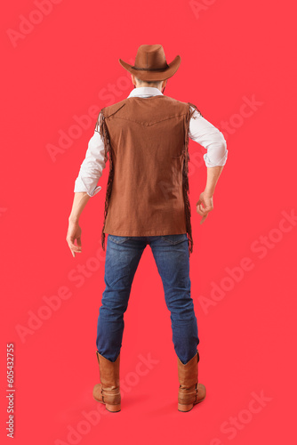 Handsome cowboy on red back...