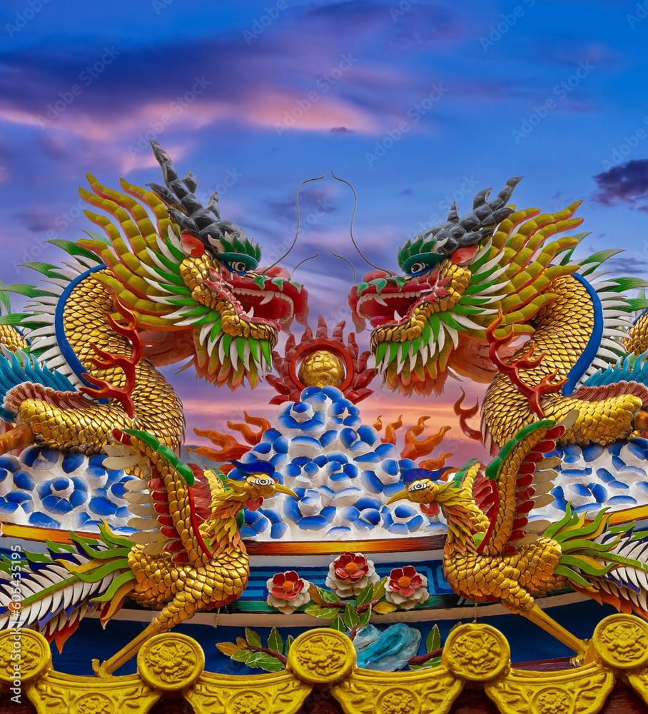 Colourful multicoloured dragon on top of a  temple in Patong Phuket Thailand. beautiful blue green red of the scale dragons