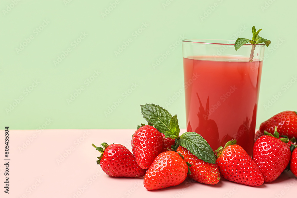 Glass of tasty strawberry juice on white table Glass of tasty strawberry juice on white table