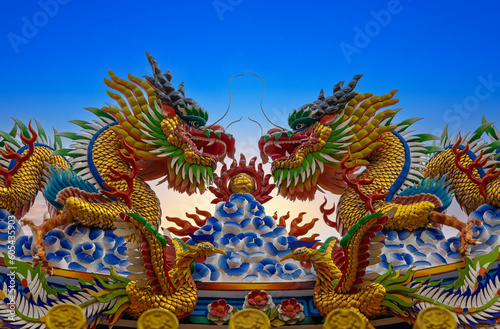 Colourful multicoloured dragon on top of a temple in Patong Phuket Thailand. beautiful blue green red of the scale dragons