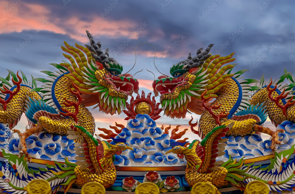 Colourful multicoloured dragon on top of a  temple in Patong Phuket Thailand. beautiful blue green red of the scale dragons