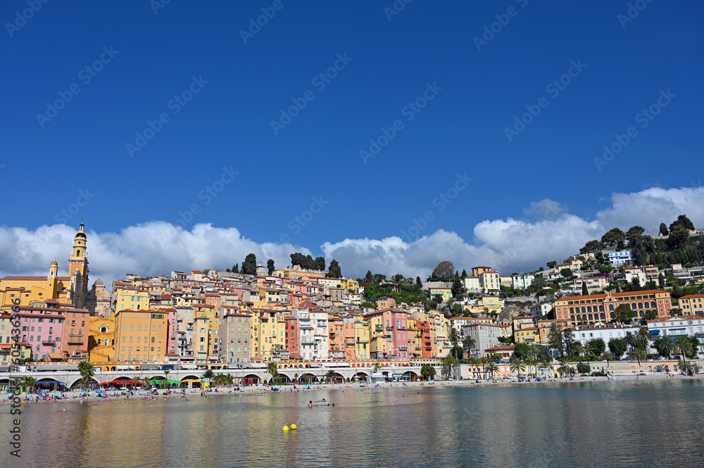 Beach and colorful old buildings in Menton France skyline