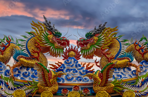 Colourful multicoloured dragon on top of a temple in Patong Phuket Thailand. beautiful blue green red of the scale dragons