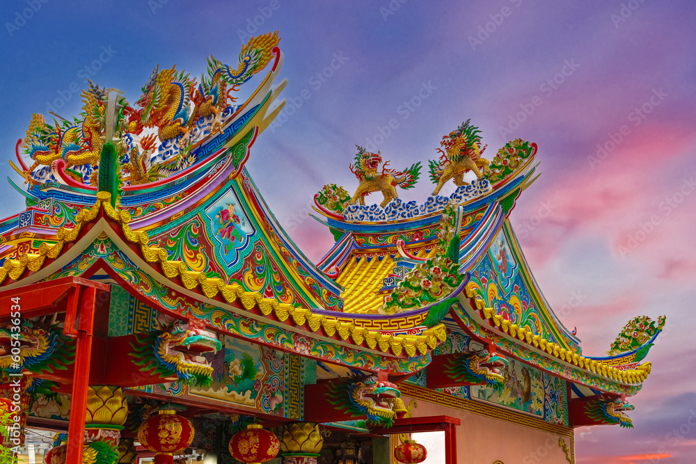 Colourful multicoloured dragon on top of a temple in Patong Phuket Thailand. beautiful blue green red of the scale dragons Colourful multicoloured dragon on top of a temple in Patong Phuket Thailand. beautiful blue green red of the scale dragons