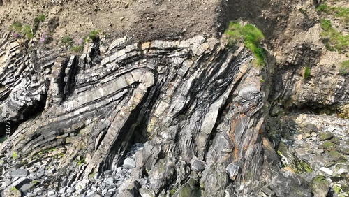 metamorphic rock formation on coastal cliff in ireland photo