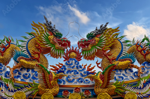 Colourful multicoloured dragon on top of a temple in Patong Phuket Thailand. beautiful blue green red of the scale dragons