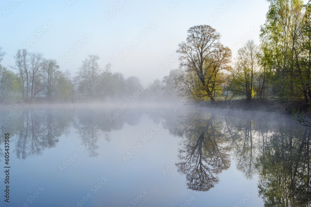 summer landscape with sunrise, fog and the river