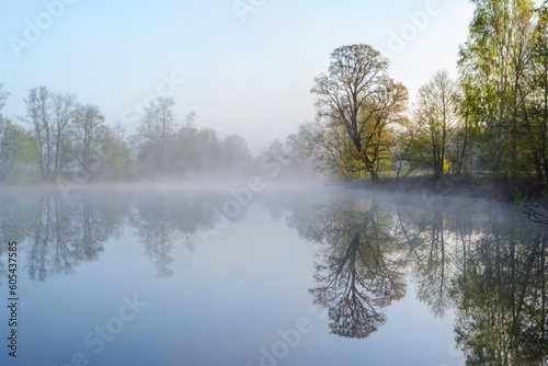 summer landscape with sunrise, fog and the river