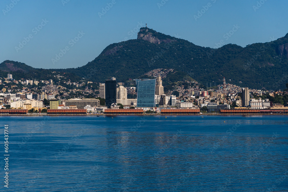 Beautiful view of Guanabara Bay in Rio de Janeiro, Brazil with the port, hills, Christ the Redeemer and buildings in the background. Beautiful landscape and hill with the sea. Sunny day