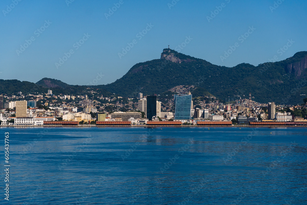 Beautiful view of Guanabara Bay in Rio de Janeiro, Brazil with the port, hills, Christ the Redeemer and buildings in the background. Beautiful landscape and hill with the sea. Sunny day