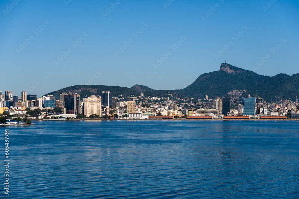Beautiful view of Guanabara Bay in Rio de Janeiro, Brazil with the port, hills, Christ the Redeemer, Museum of Tomorrow and buildings in the background. Beautiful landscape and hill with the sea. 