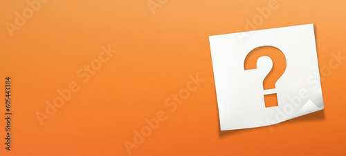 Note paper with question mark on orange background	