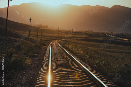 Railroad in the mountains at warm sunset light © chaossart