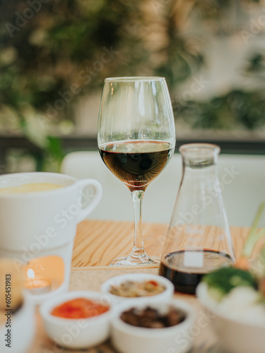 glass of wine and vegan fondue