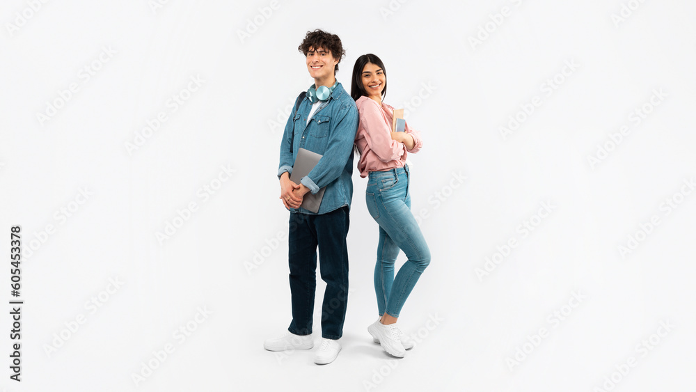Students Couple Posing With Laptop Computer And Textbooks, White Background