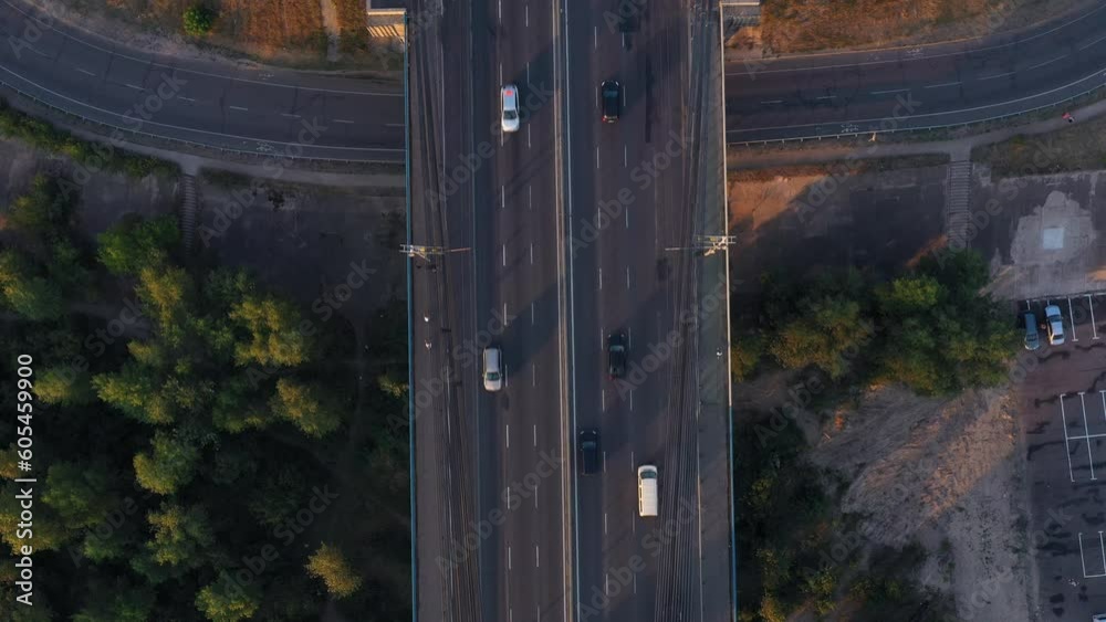 Motorway road with moderate car traffic in the evening. Aerial view from above. Motorway road with moderate car traffic in the evening. Aerial view from above.