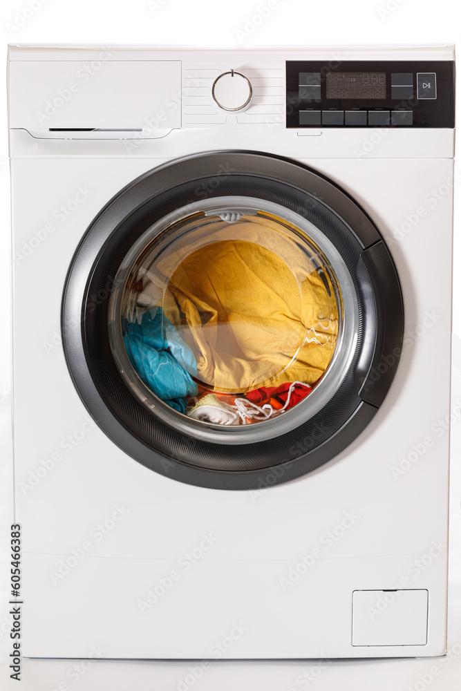 Washing machine loaded with laundry before washing. Close-up. Washing machine loaded with laundry before washing. Close-up.