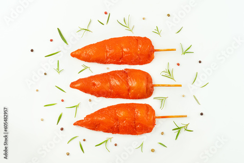 Fresh raw marinated chicken meat skewers iner fillet on a white background.Top view.Copy space.Closeup of chicken meat.Chicken breast inner Fillets.Marinated Chicken skewers fillet meat.