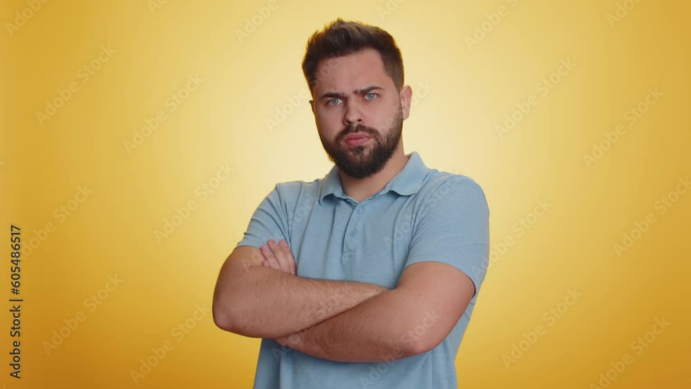 Young caucasian man showing tongue making childish faces at camera, fooling around, joking, aping with silly face, teasing, bullying abuse. Handsome guy isolated on studio yellow background indoors Young caucasian man showing tongue making childish faces at camera, fooling around, joking, aping with silly face, teasing, bullying abuse. Handsome guy isolated on studio yellow background indoors