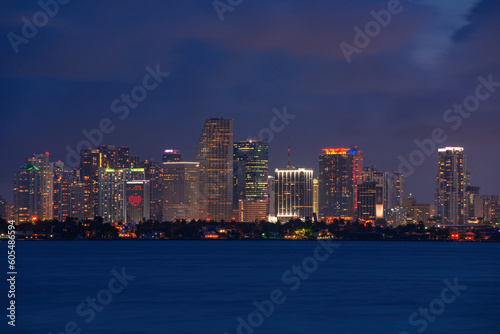 Miami downtown. Skyline city miami lighting lights sea ocean sunset night cityscape buildings downtown, architecture skyscraper dusk panorama.