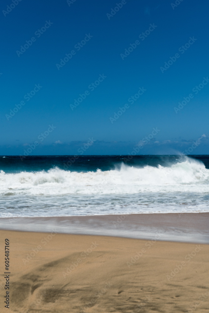 Watching the waves at Hanakapi`ai Beach in Kauai, Hawaii Watching the waves at Hanakapi`ai Beach in Kauai, Hawaii