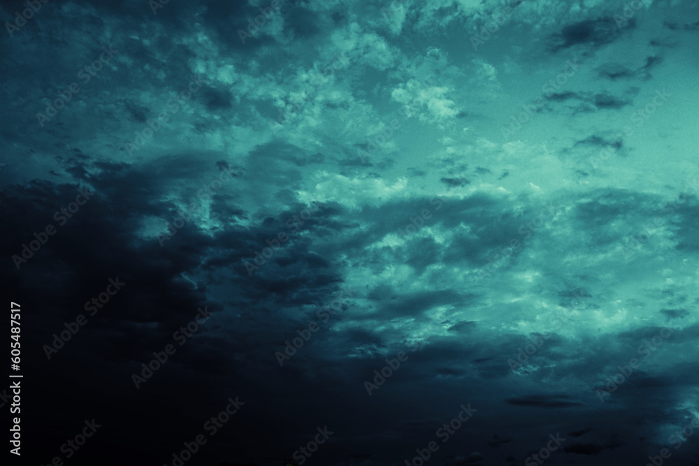 Black blue green teal night sky with clouds. Storm, wind, rain. Dramatic dark skies background. Glow, light, lightning. Magical, mystical, ominous, frightening, spooky, fantasy, fantastic heaven.