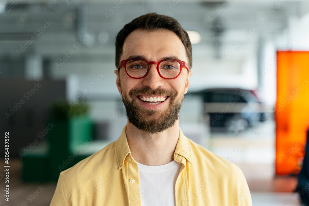 Fototapeta premium Confident businessman, sales manager in stylish spectacles, smiling looking confidently at camera