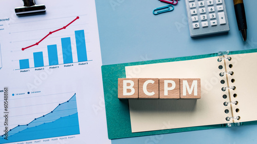 There is wood cube with the word BCPM. It is an abbreviation for Business Continuity Plan Management as eye-catching image. photo