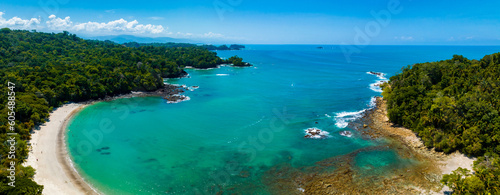 Fototapeta Naklejka Na Ścianę i Meble -  Aerial view of Manuel Antonio National Park in Costa Rica. The best Tourist Attraction and Nature Reserve with lots of Wildlife, Tropical Plants and paradisiacal Beaches on the Pacific Coast.