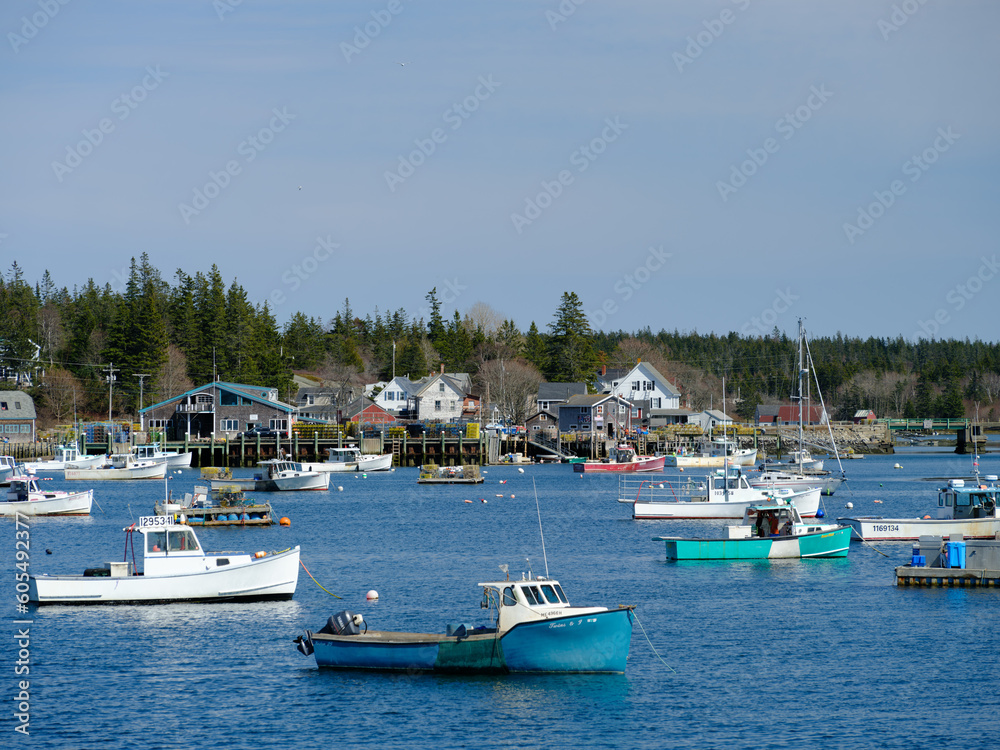 Lobster boats of all shapes and colors docked in the protected harbor on the colorful and quaint Vinalhaven Harbor Maine