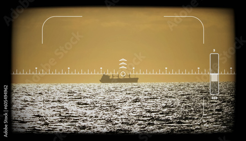 Target on a Bulk carrier, grain ship in the sea. Target the ship through a periscope viewfinder. photo