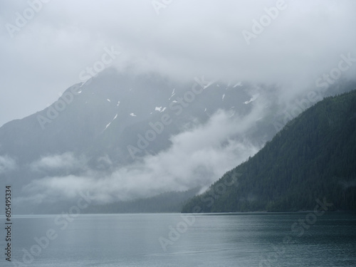 Fog and mist envelope the mountains and glaciers on Prince William Sound near Whittier Alaska