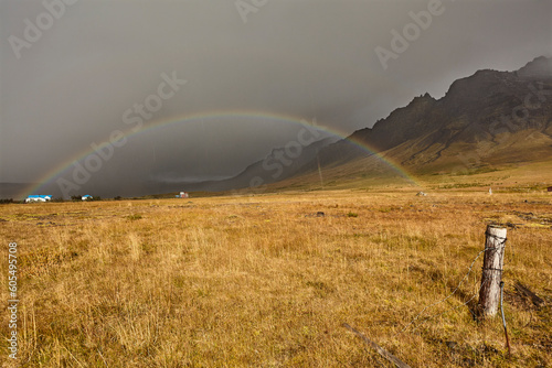 A rainbow arcs across countryside near the town of Stykkisholmur, Snaefellsnes peninsula, west coast of Iceland, Polar Regions photo