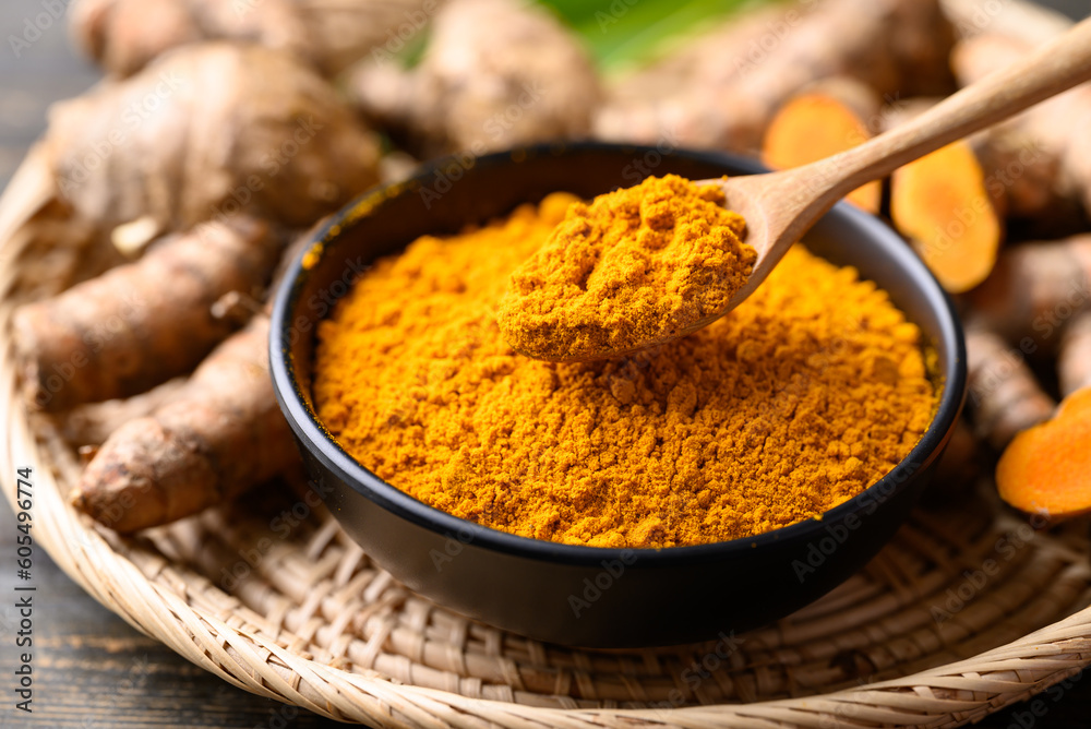 Turmeric powder and fresh turmeric (Curcuma, curcumin), Organic ingredient in Asian cuisine, food coloring or natural dyeing