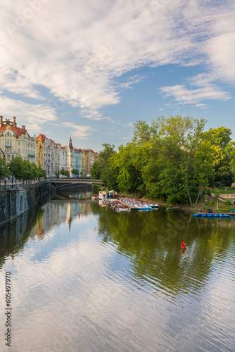 Art nouveau buildings along Vltava River and boats at Slovansky island, Prague, Czech Republic (Czechia), Europe photo