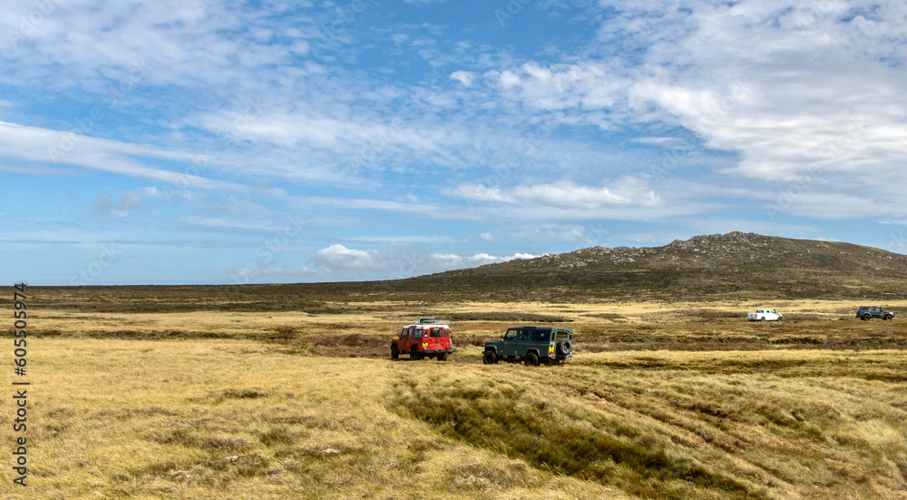Off-road vehicles transporting tourists to Volunteer Point in the Falkland Islands Off-road vehicles transporting tourists to Volunteer Point in the Falkland Islands
