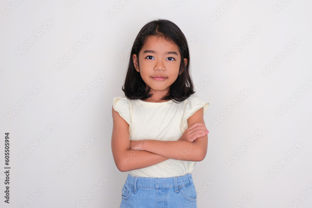 Asian little girl looking confident with arms crossed Asian little girl looking confident with arms crossed