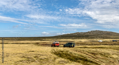 Off-road vehicles transporting tourists to Volunteer Point in the Falkland Islands
