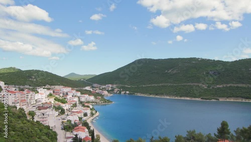 Timelaps of clouds passing over the bay of Neum with its beach by the sea, in Bosnia