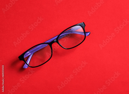 Trendy glasses isolated on red background, with copy space for message and quote