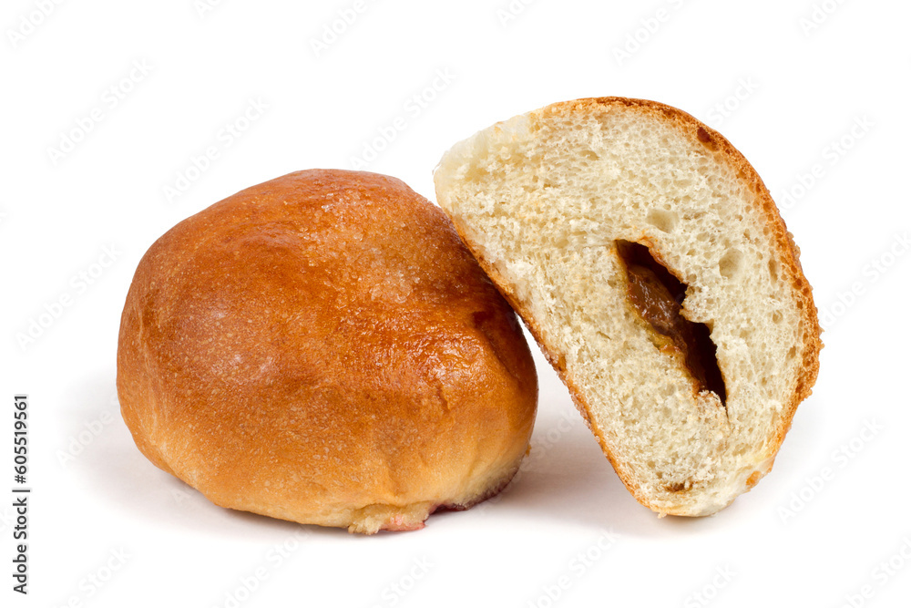 Sweet bread with filling. A whole and half a bun. Round bun on a white background.